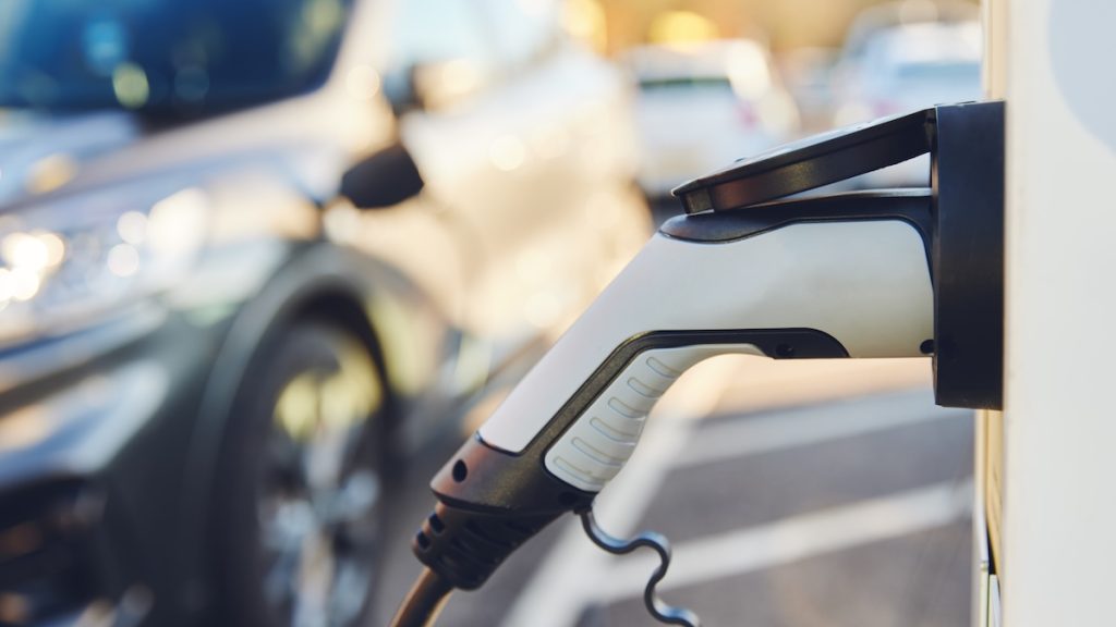 Electric Car Charging Point with electric car behind